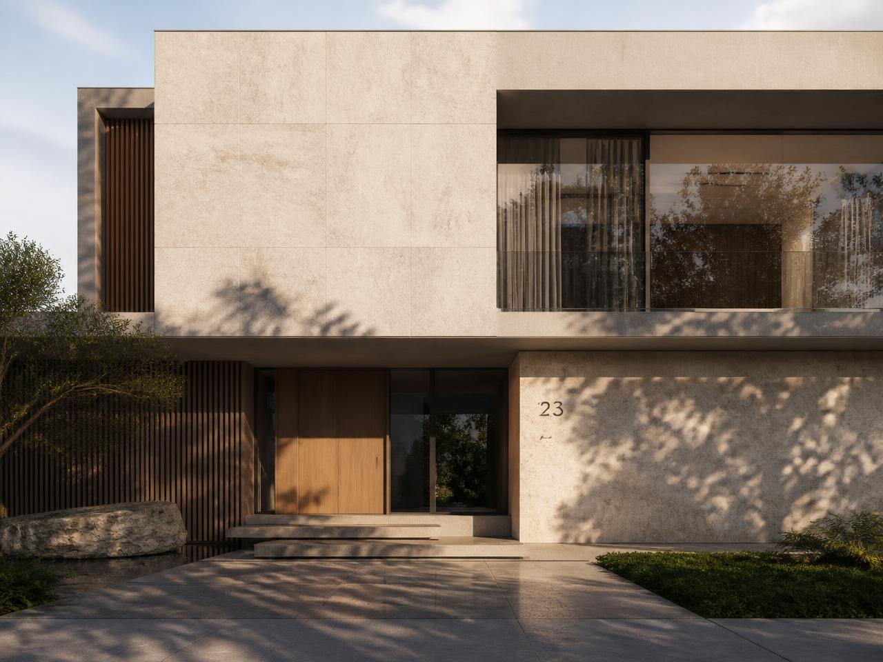 Contemporary stone and glass residence in warm afternoon light
